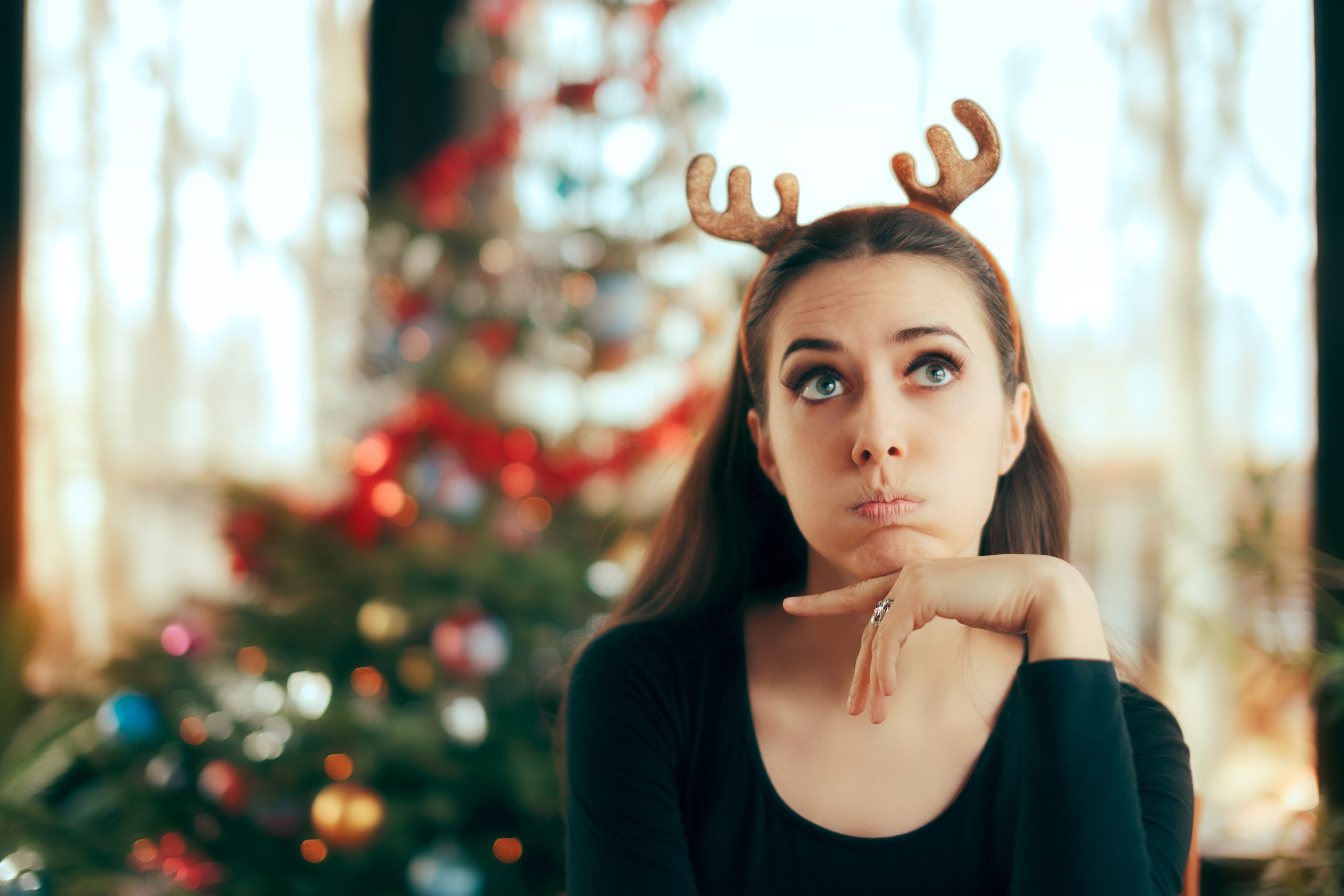 Another Covid Christmas, Tips for a Mentally Healthy Festive Season 6 girl in from of xam tree thinking about Christmas