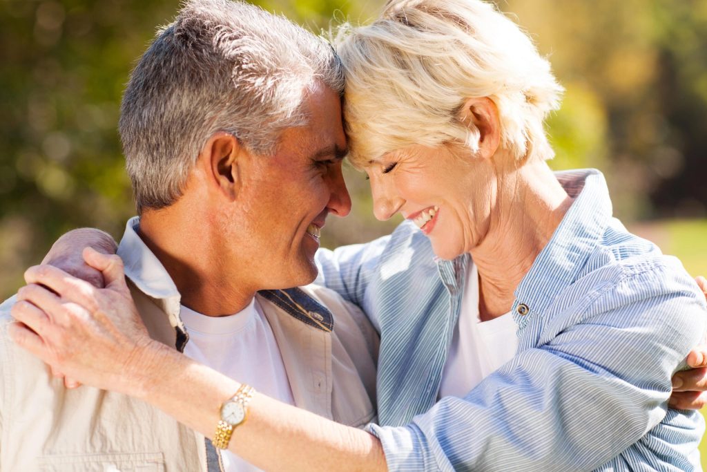 How to Maintain Intimacy in Your Relationship 12 Intimacy in relationships - mature couple embracing, spending time together in the outdoors