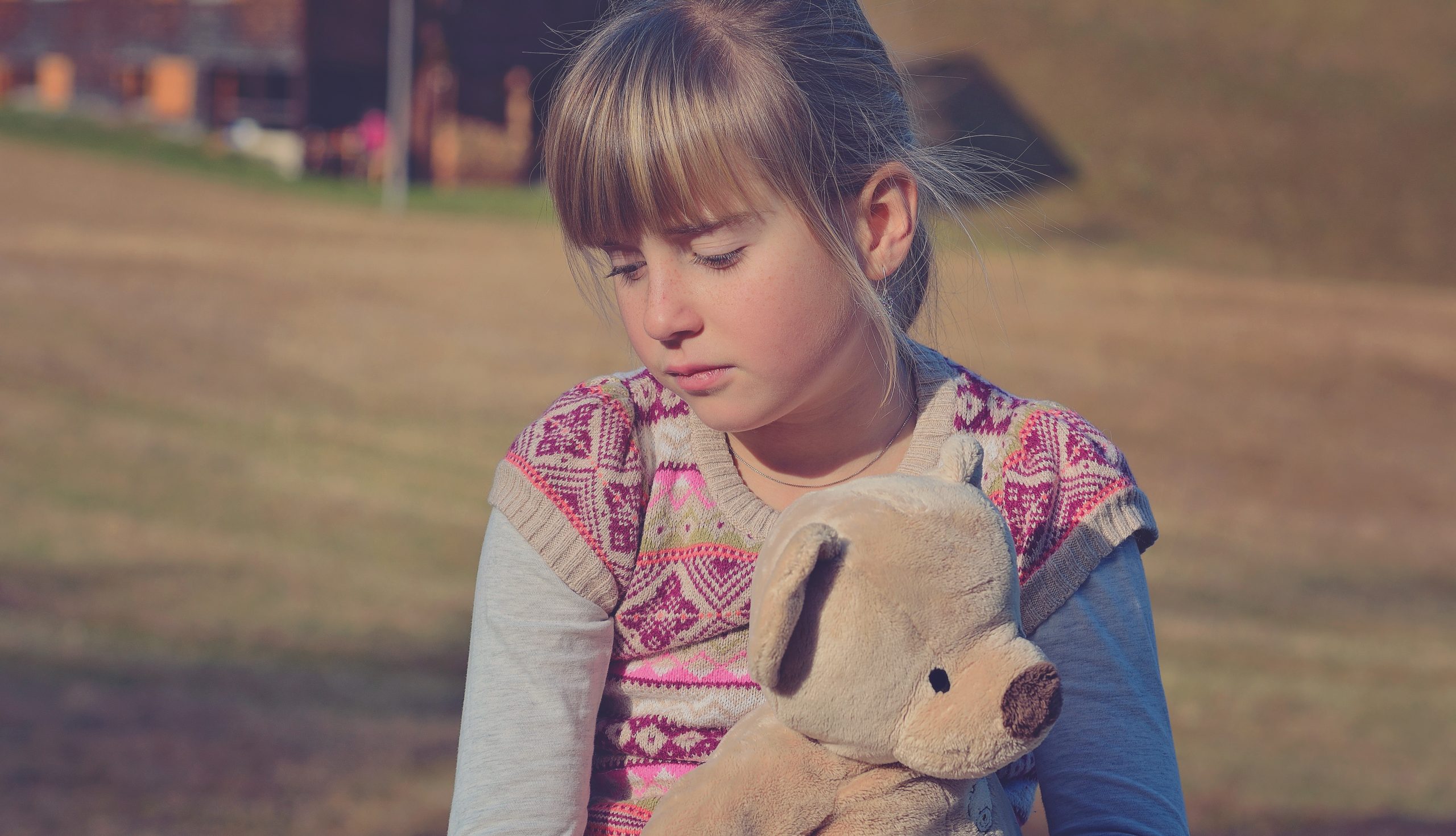 sad child, helping kids cope with grief