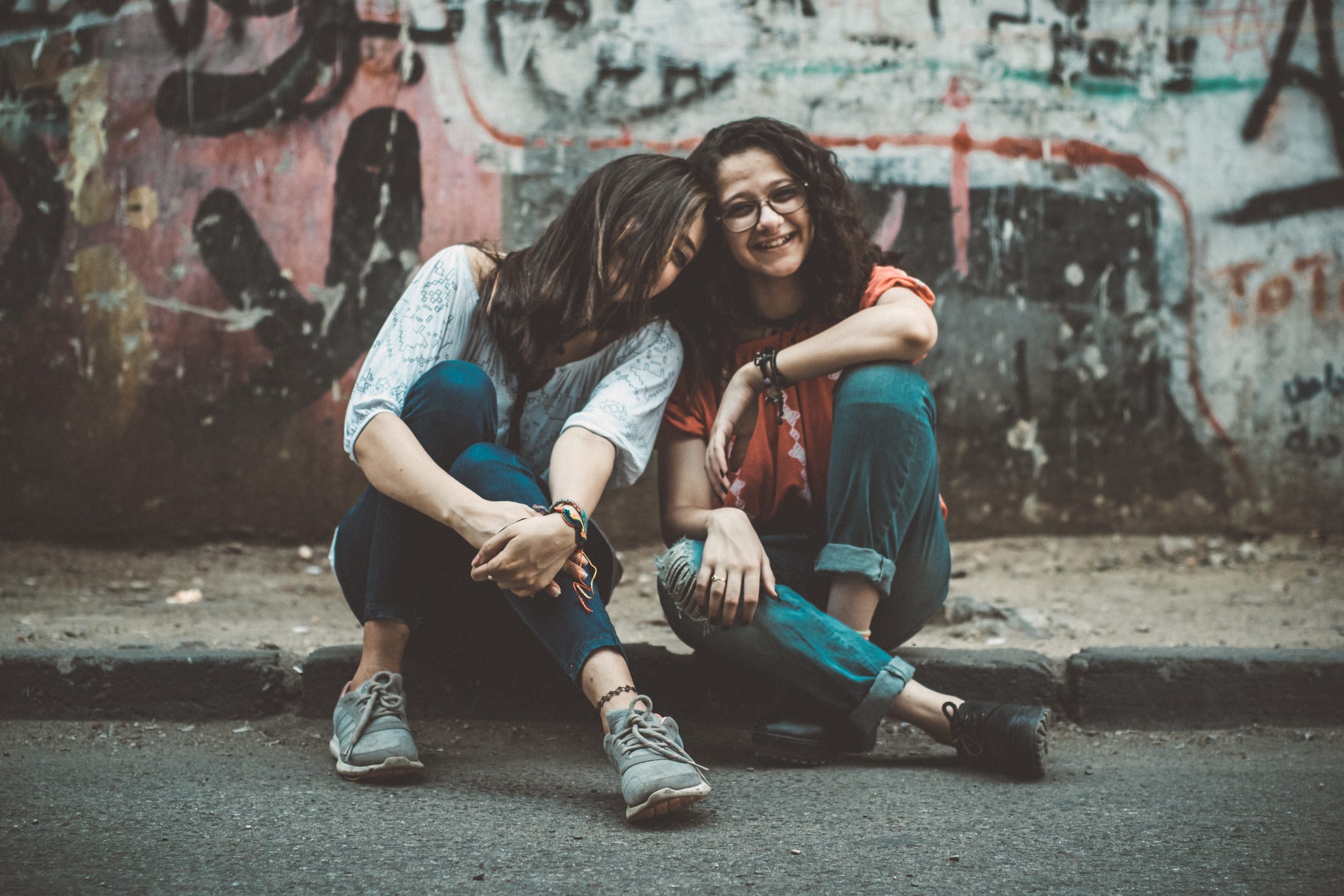 Tips to Improve Youth Mental Health in 2018 3 youth, teenage girls sitting, grunge background