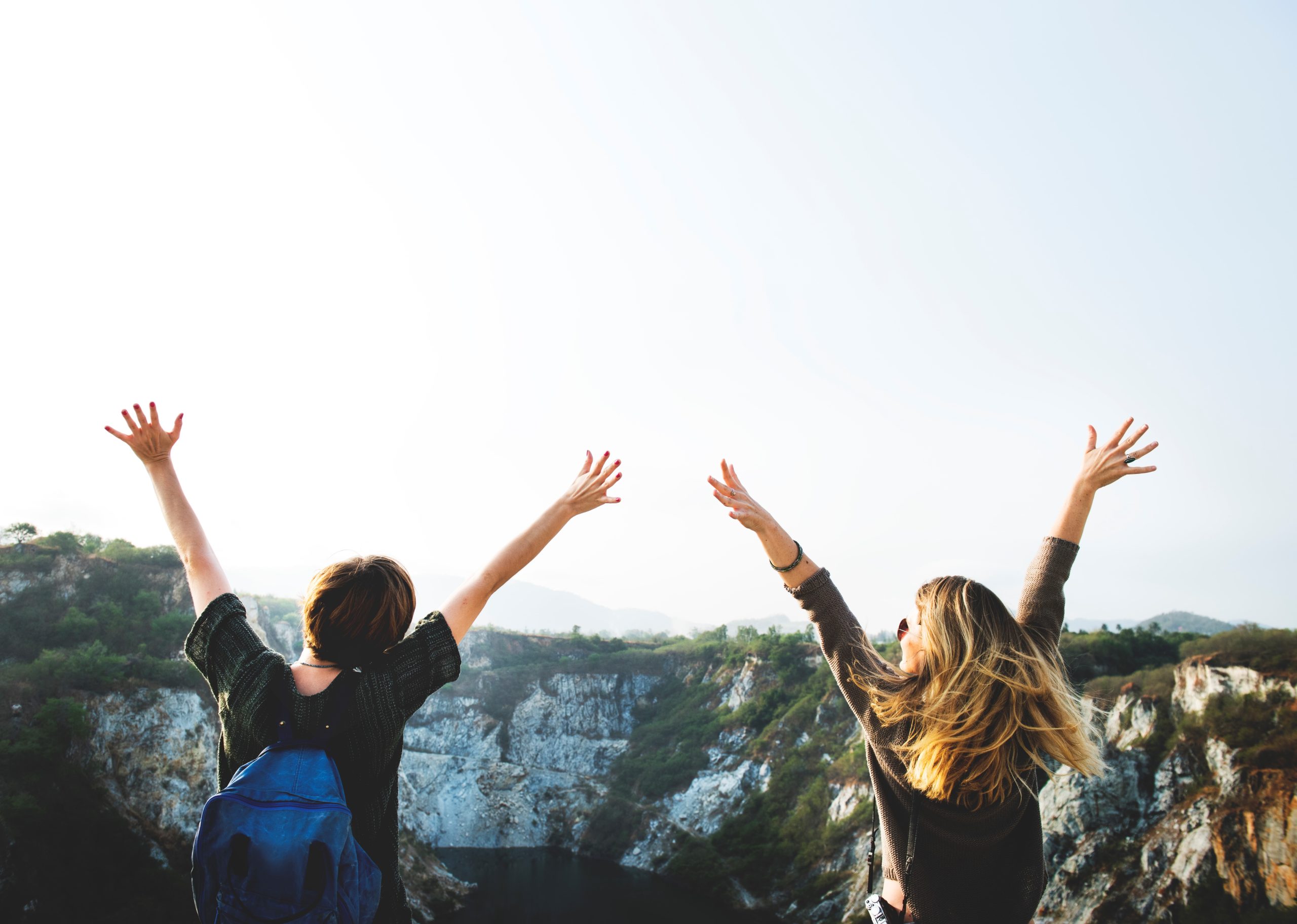improve mental health, nature, two people with hands in the air