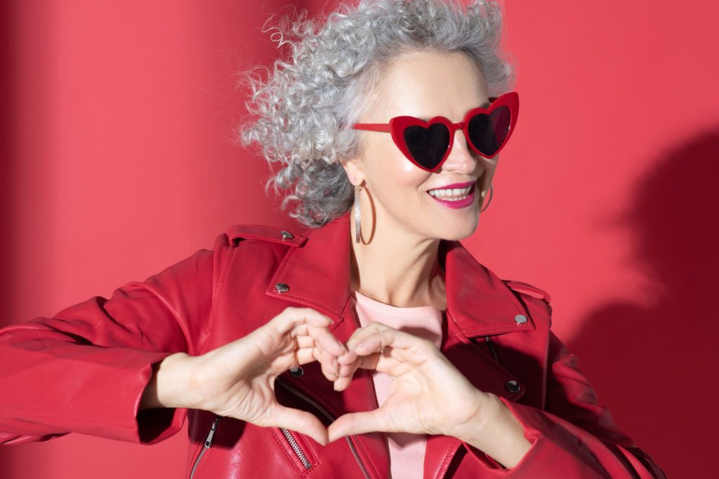 love yourself, woman making heart shape with hands
