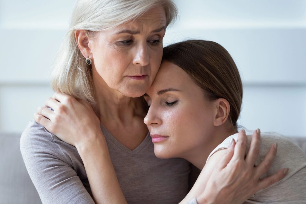 PTSD trauma, two women hugging